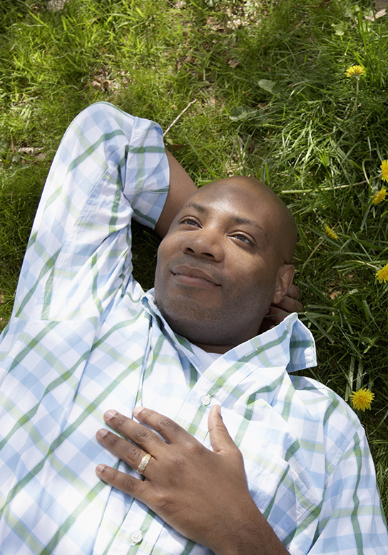 man lying in the grass