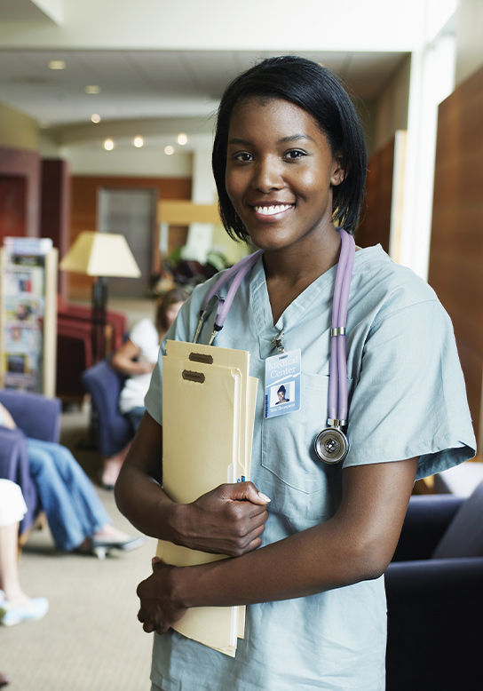 nurse standing with files